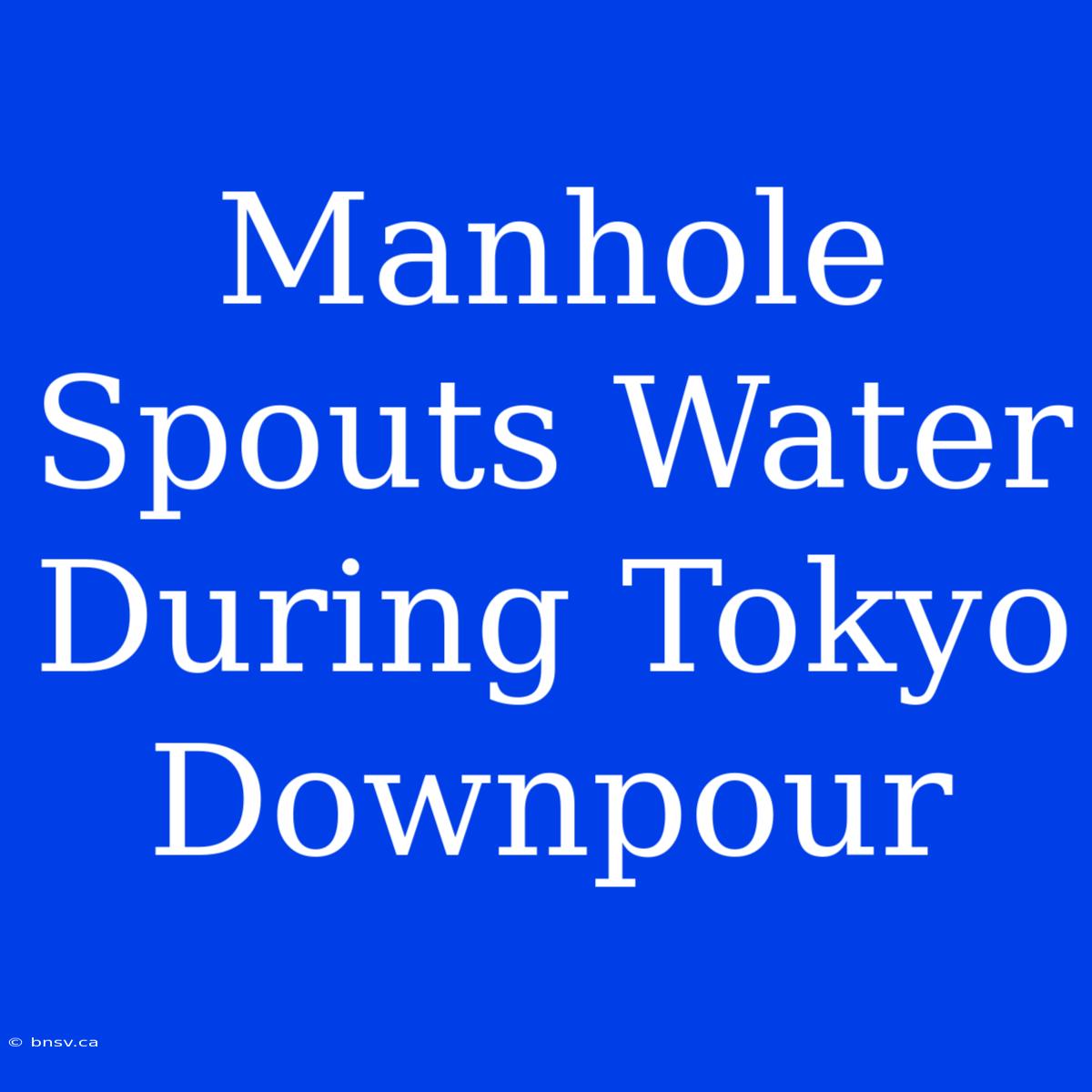 Manhole Spouts Water During Tokyo Downpour